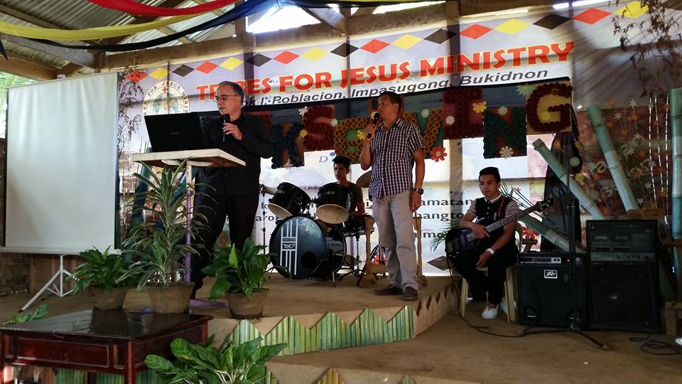 My Dad preaching with Pastor Julito DeGracia interpreting for him in Impasug-Ong, Philippines 
