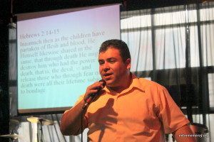 Pastor Joshua Hernandez preaching at Redeemed Covenant Church which meets at the Refuge. 
